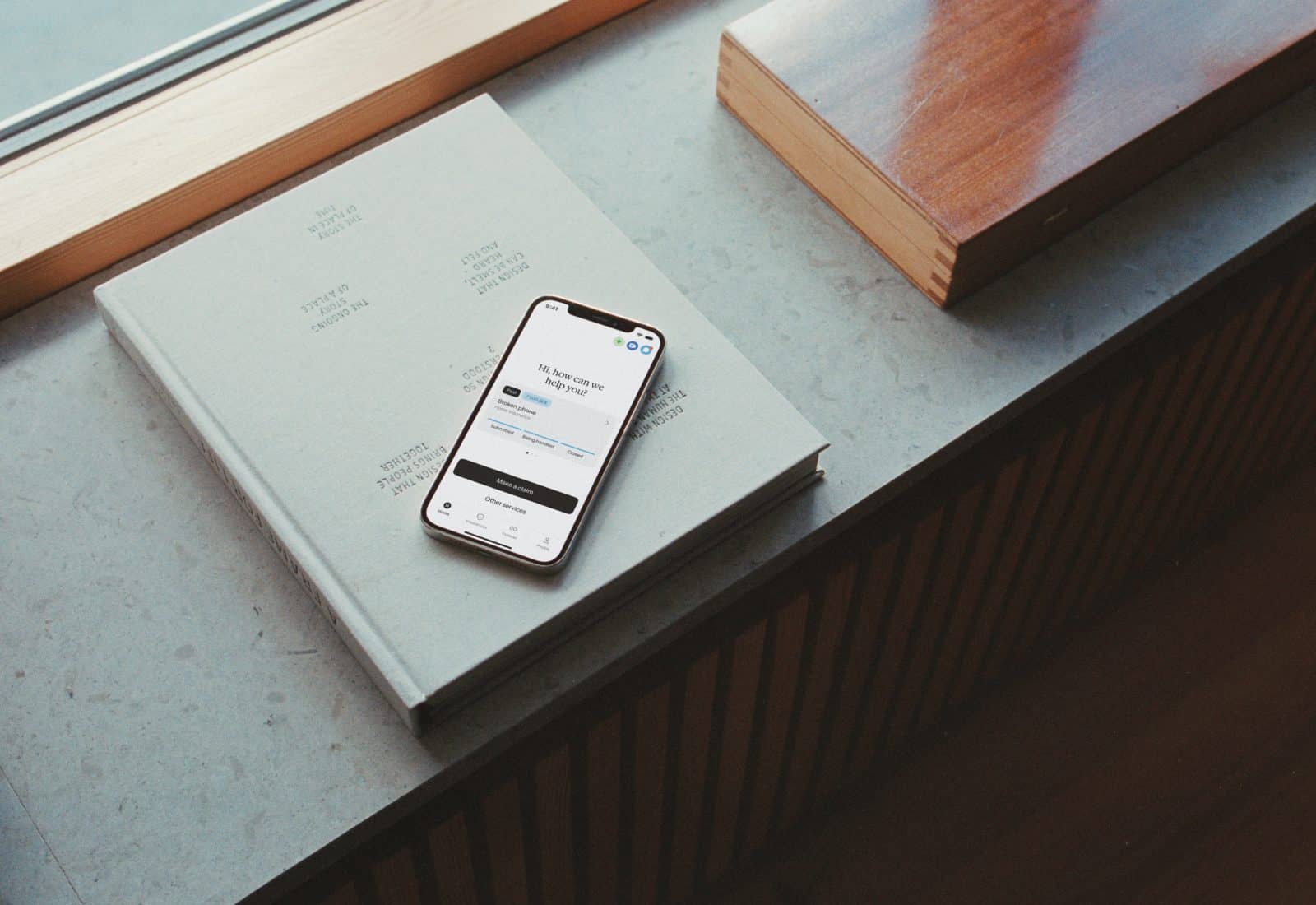 Phone on the windowsill of a house.